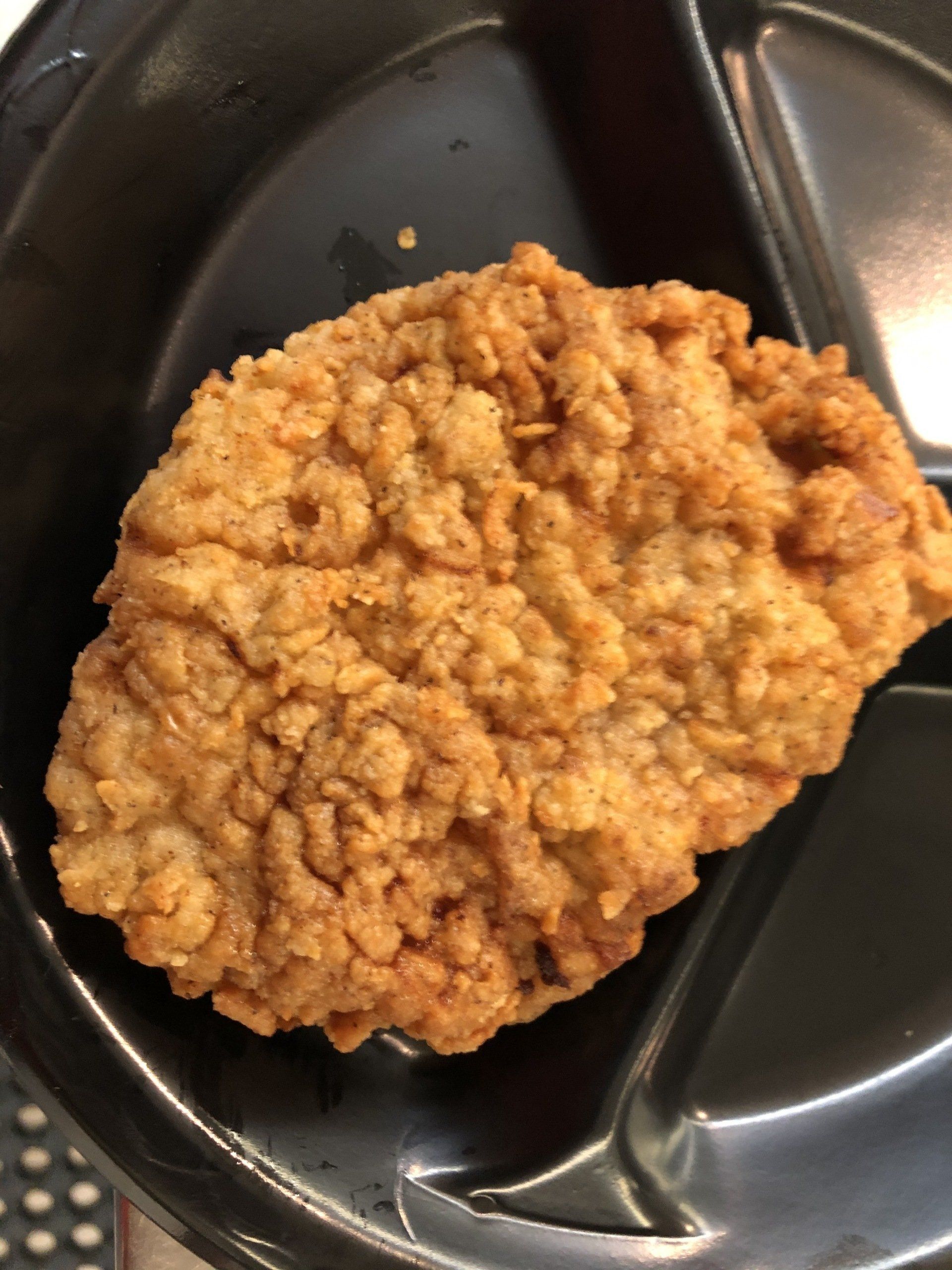 Homestyle cafeteria meal with meat and vegetables